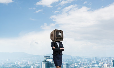 Business woman with old TV instead of head.