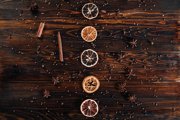 Dried fruits with spices on wooden background