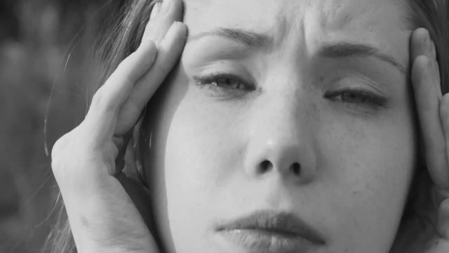 young girl has a headache