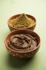 Henna / Mehandi powder and paste. Prepared for Hair colouring or for tattoo on hand in Indian weddings/festivals. selective focus