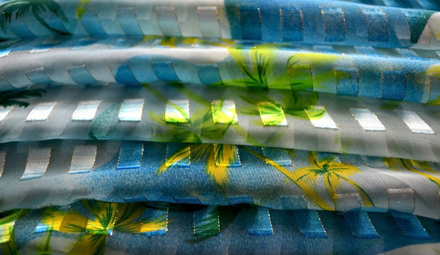 Silk white-blue scarf, folded in parallel waves, with a printed floral   pattern