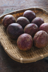 Obraz premium Passion fruit on rustic background.