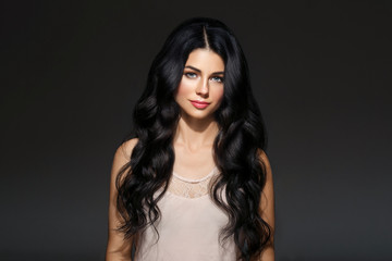 Fototapeta premium Beautiful woman face studio portrait. Beauty black long hair.