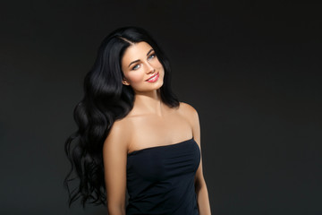 Fototapeta na wymiar Black hair woman. Beautiful brunette hairstyle fashion portrait over dark background