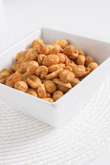 Dry or oven roasted peanuts lightly seasoned eaten as high protein snack