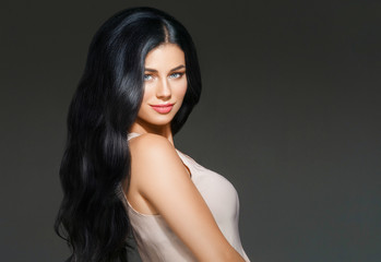 Fototapeta premium Beautiful woman face studio portrait. Beauty black long hair.