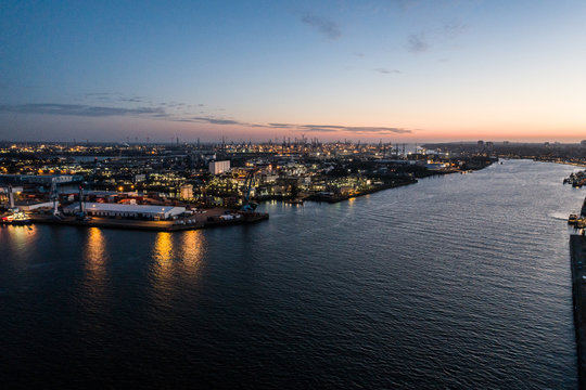 Aerial view of the harbor district, the concert hall "Elbphilharmonie" and downtown Hamburg, Germany, at dusk. 