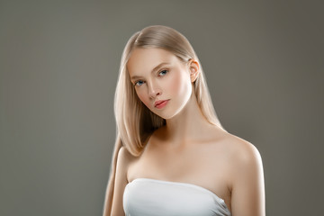 Beautiful Woman Face Portrait Beauty Skin Care Concept with long blonde hair 