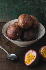 Passion fruit on rustic background.