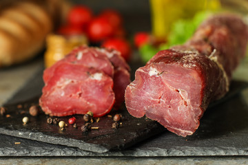 salami, salted meat jerky - sliced ​​with slices (venison) . food background.  Top view with copy space