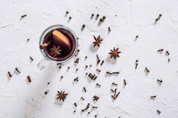 Mulled wine with spices and empty space for text on white background