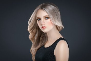 Fototapeta premium Beautiful Blonde Woman Beauty Model Girl over black background.