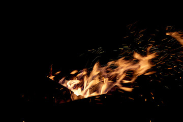 Fototapeta na wymiar Fire flames on a black background. The fire burns on a black background.