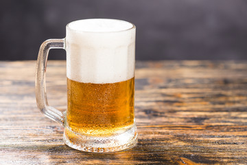 Food and drink concept - Glass beer on wood background with copy space