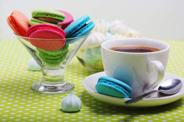 A cup of coffee and macaroons ready for breakfast