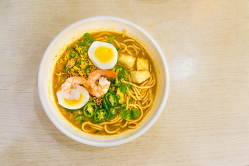 Laksa noodles is a spicy soup popular in Singapore local delicious food