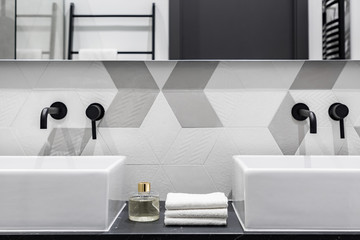 Washbasins with black faucets