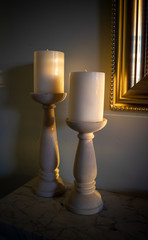 Candle Sticks on Marble Mantle by Gold Frame