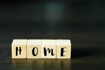 HOME - word build from wooden cubes, selective focus, free copy space