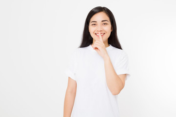 Shh hush sign. Young asian woman isolated on white background in blank summer t shirt. Copy space. Japanese girl