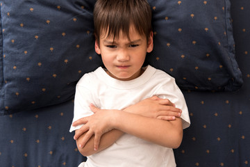 Naughty little boy won't go to sleep