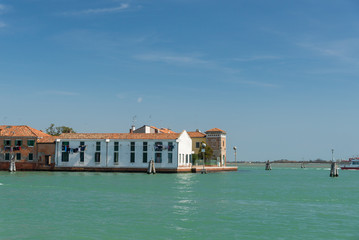 Gondola passing by multicolored buildings