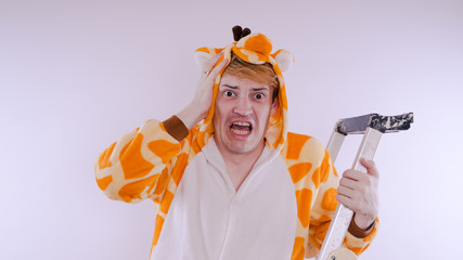 guy in a bright children's pajamas in the form of a kangaroo, on white background. emotional...