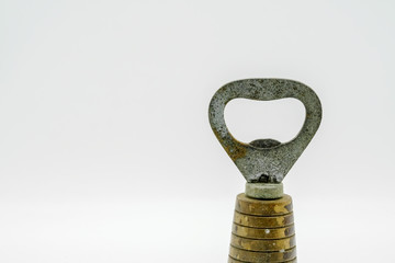 Old rusty beer bottle opener isolated on white background