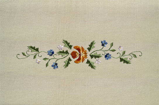 Border of wavy branches with orange,blue and white flowers on twisted stems from  cotton fabric
