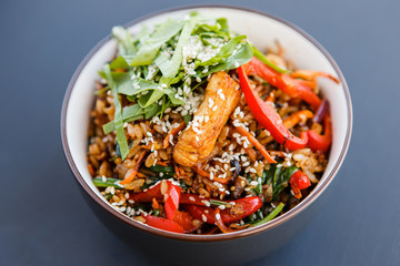 A plate of a wok rice on the dark background