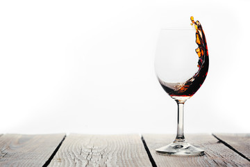red wine being poured into a glass 