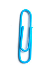 closeup of blue paperclip on white background