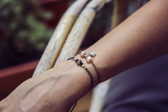 Tiny fashionable bracelets on female hand