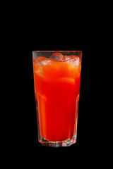 Single-colored, red cocktail in a glass with ice from grapefruit, tomato, strawberry. Side view. Isolated black background. Drink for the menu restaurant, bar, cafe