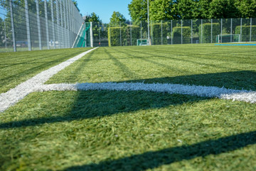 football or soccer field with green meadow