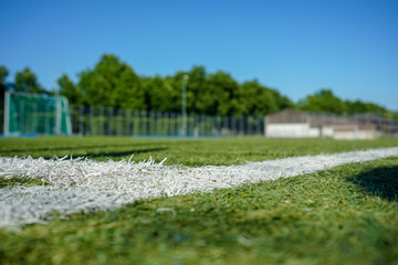 football or soccer field with green meadow