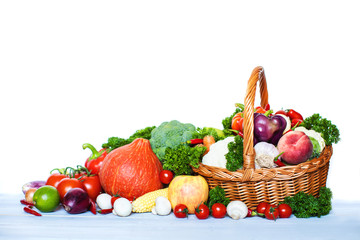 Fresh vegetables and fruits in a basket.