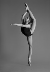 Flexible girl in black bodysuits