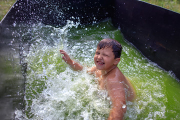 Portrait of a boy bathing in the pool