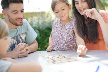 Happy family enjoying playing game together