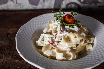 Pasta with mushrooms in creamy sauce