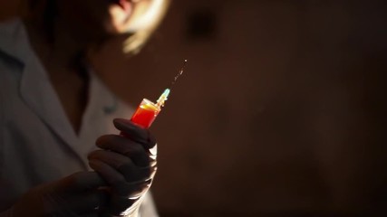 Monstrous doctor stained blood and with bandage on one eye, holds syringe with blood
