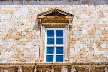     window in old wall of the town 