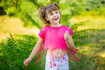 Happy little girl brushing her teeth. Dental hygiene. Healthy concept