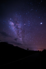 Night sky stars with milky way on mountain background