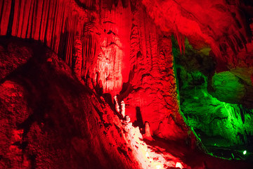 Fototapeta na wymiar lime inundation in a cave in red light
