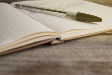 Work and time management, opened notebook over rustic, old textured wooden table. Copy space. Back to school.