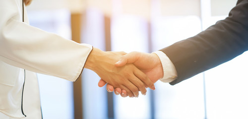 close up investor businessman handshake with partner