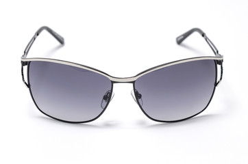 Sunglasses in an iron frame with brown glass isolated on white