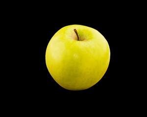 Fresh green apple on a dark background